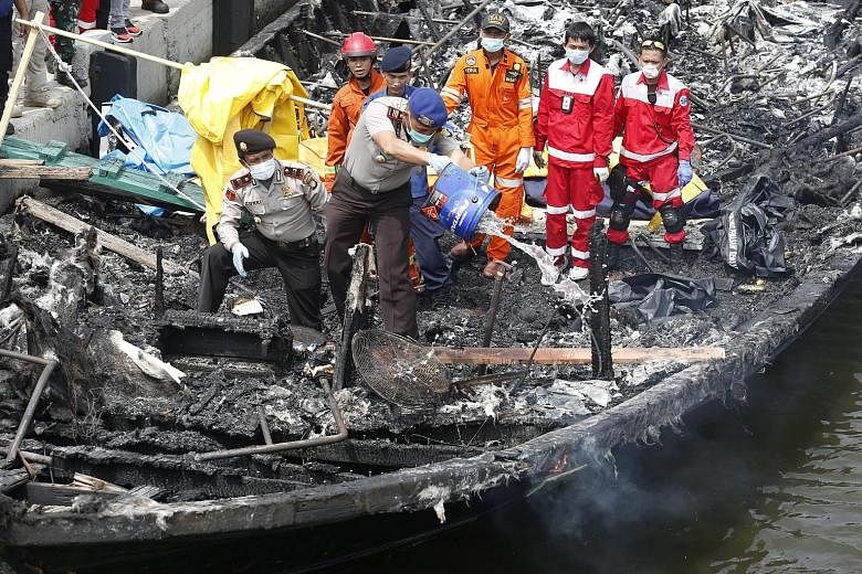 Indonesian rescuers looking for bodies of victims of the Jan 1 ferry disaster.
