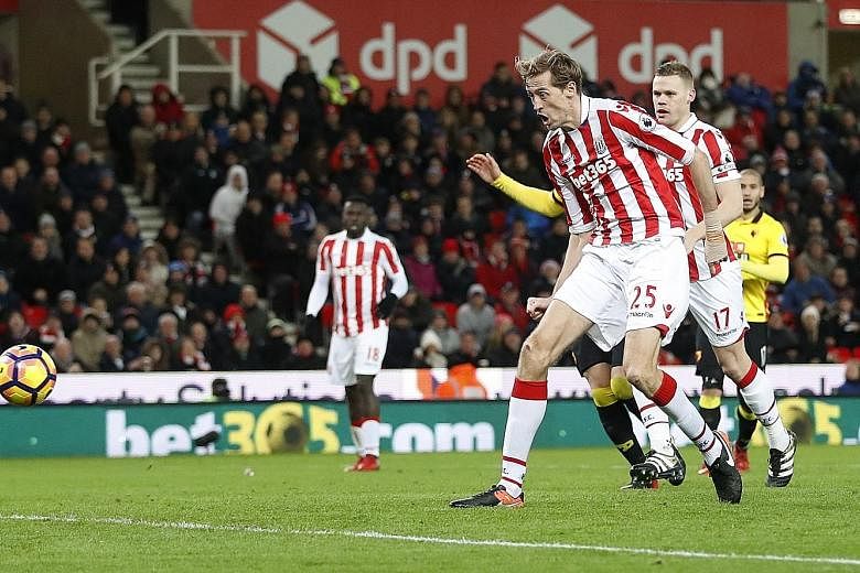 Peter Crouch scoring Stoke City's second goal. It was only his second league goal of the season, but enough to condemn Watford to a 2-0 defeat, their sixth in eight games.