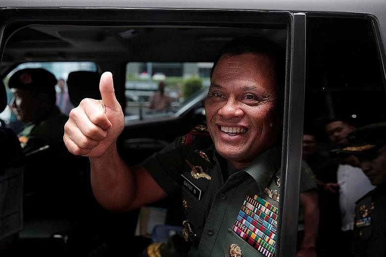 TNI chief Gatot (right) told reporters yesterday that a TNI officer saw teaching materials at Campbell Barracks that apparently "disparaged" the TNI and Indonesians.