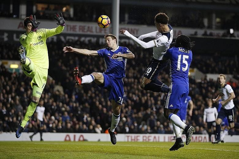 Dele Alli leaping to head his second goal in Tottenham's 2-0 win over EPL leaders Chelsea. While overjoyed at the result, manager Mauricio Pochettino urged the team to be consistent for the entire season.
