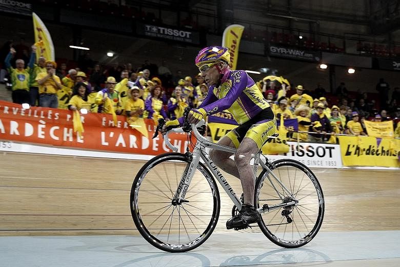 French cycling enthusiast Robert Marchand, 105, covering 22.528km in an hour at a velodrome in Saint-Quentin-en-Yvelines, near Paris.