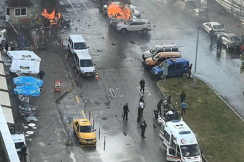 Cars burning in the street at the site of the explosion in the Turkish coastal city of Izmir yesterday. Separately in Syria, at least 15 people were killed in a car bombing in Jableh city, said the Syrian Observatory for Human Rights monitoring group