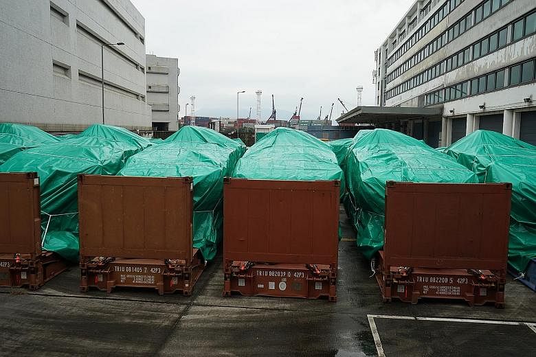 The SAF's nine Terrex infantry carriers at a Hong Kong Customs storage facility last month, after being seized on Nov 23 while they were on their way back from a military exercise in Taiwan.
