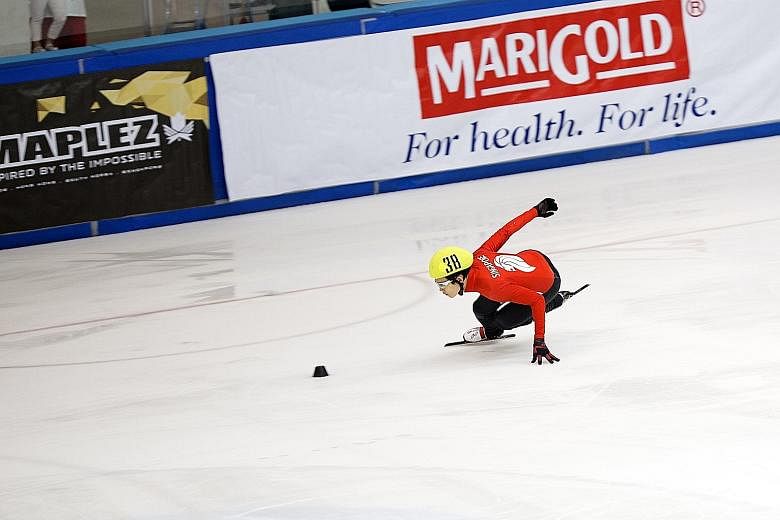 Singapore short track speed skater Lucas Ng in action at the MapleZ Southeast Asian Short Track Trophy yesterday. The 28-year-old won both his events on the first day of the competition, with Malaysian Wong De-Vin behind him.
