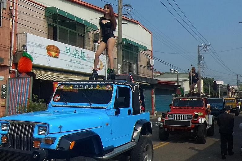 The funeral procession of local councillor Tung Hsiang in Chiayi, southern Taiwan, stretched for several kilometres and featured 200 vehicles and 50 pole dancers.