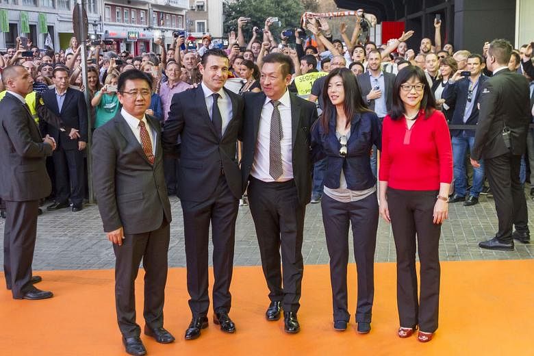 From left: Valencia board director Koh Kim Huat, former president Amadeo Salvo, owner Peter Lim and his wife Cherie, and club president Chan Lay Hoon outside the Mestalla Stadium in 2014. Lim was attending his first game after winning the bid to take over