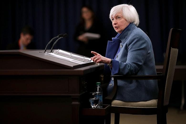 Dr Yellen (right) will host a town hall meeting with educators on Thursday but US President-elect Donald Trump's news conference the day earlier may have a greater impact on markets.