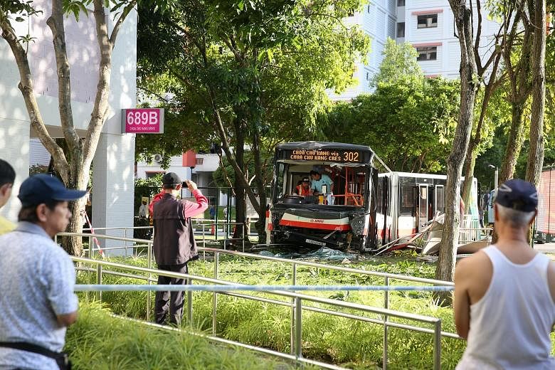 The SMRT bendy bus is believed to have collided with a car at about 2pm yesterday, before it veered off the road and crashed into a tree. It landed up on the pavement near Block 689B, Choa Chu Kang Drive. SMRT is assisting the Traffic Police with inv