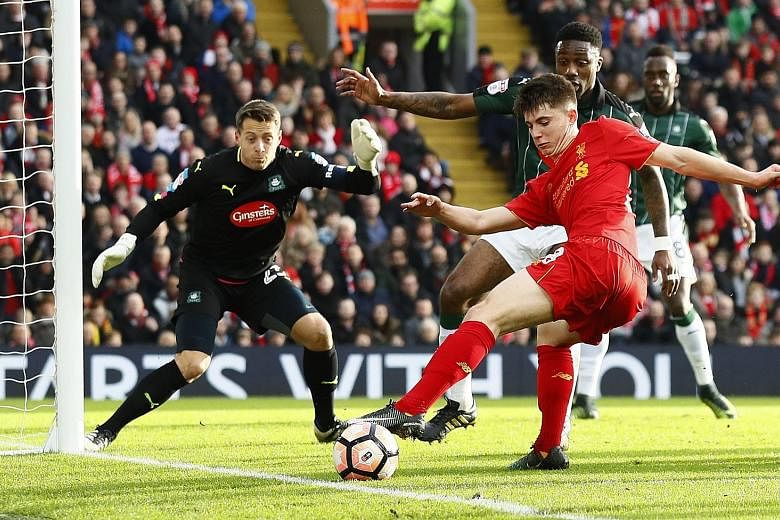 Liverpool's Ben Woodburn showing a pair of quick feet to carve out a chance at goal as the Plymouth defence closes in. The Reds academy product was one of the few bright spots in a game where clear-cut opportunities were hard to come by.