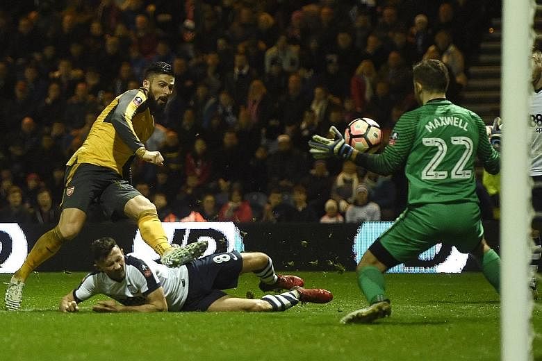 Arsenal striker Olivier Giroud scoring the 89th-minute winner against Preston in the FA Cup third round. His goal completed a 2-1 comeback win for the Gunners.
