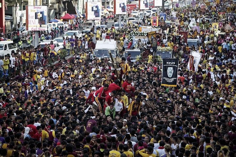 Catholics participating in a procession last Saturday in Manila, ahead of the Black Nazarene celebrations. As part of security measures for the event today, telecoms carriers have been asked to shut down cellphone signals in central Manila. A gun ban