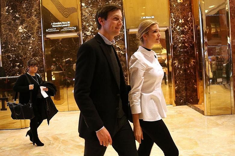Mr Kushner and his wife Ivanka in the lobby of Trump Tower. He is said to be considering a position in his father-in-law's White House administration, but experts say that such an appointment would draw legal challenges over potential violation of a 