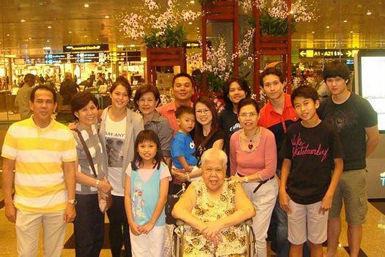 Left: Sam Quek (third from left) with some of her Singapore family at Changi Airport in 2010. Her brothers - Michael (third from right) and Shaun (extreme right) - also made the trip to their father's native country that year. Below: Marilyn and Albe