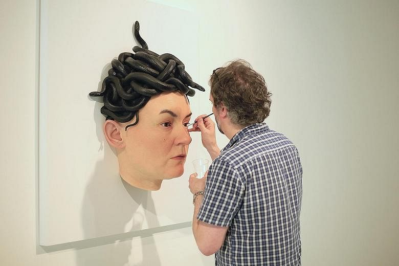Australian artist Sam Jinks working on his Medusa sculpture, which is modelled after the face of his wife, Emma.