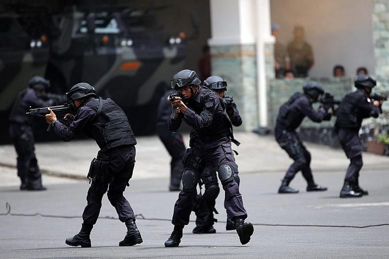 Presidential Security Forces showing their skills during a simulation of a terrorist attack in Jakarta, Indonesia, last month. The global terrorism landscape for this year will be characterised as one of higher risk, says writer Weimeng Yeo.