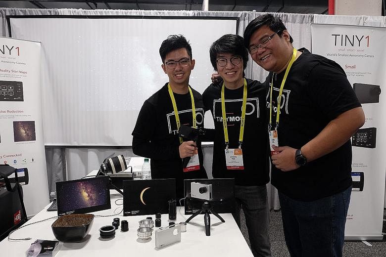 Mr Darryl Tan of Singtel Innov8 (second from left) with the team from igloohome (from left): COO and co-founder Yue Wang, Mr Chow, Ms Hara Ku and Mr Kenny Wang, sales and marketing director. Presenting the local start-up's Tiny1 astronomy camera at L