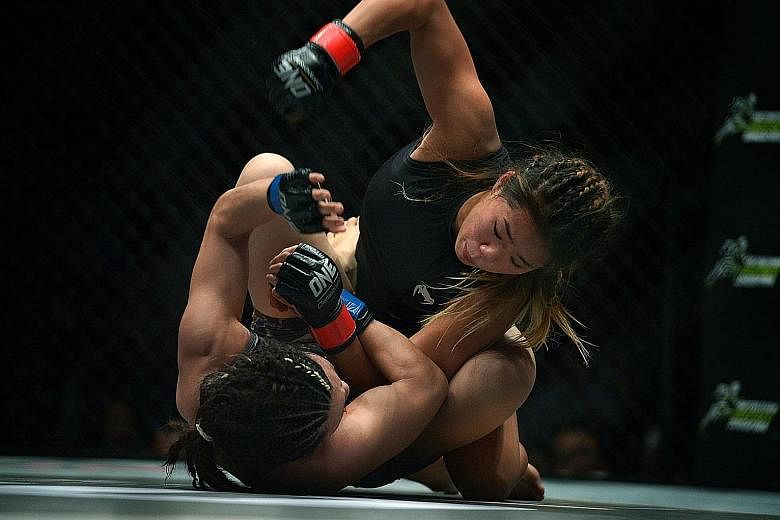 Singapore-based MMA fighter Angela Lee (on top) taking on Mei Yamaguchi of Japan in One Championship's first women's title fight. The atomweight clash last May was rated by MMAjunkie.com as one of the top five fights of 2016. Lee won by unanimous dec