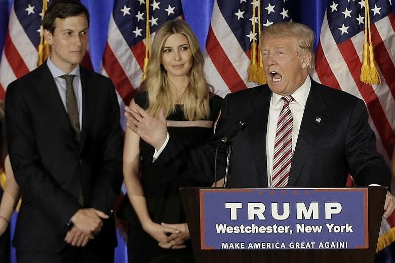Mr Trump, with son-in-law Jared Kushner and daughter Ivanka, at a campaign event in New York last June. Mr Kushner, a New York real estate developer, will divest himself of his business assets to comply with conflict-of-interest rules, says his lawye