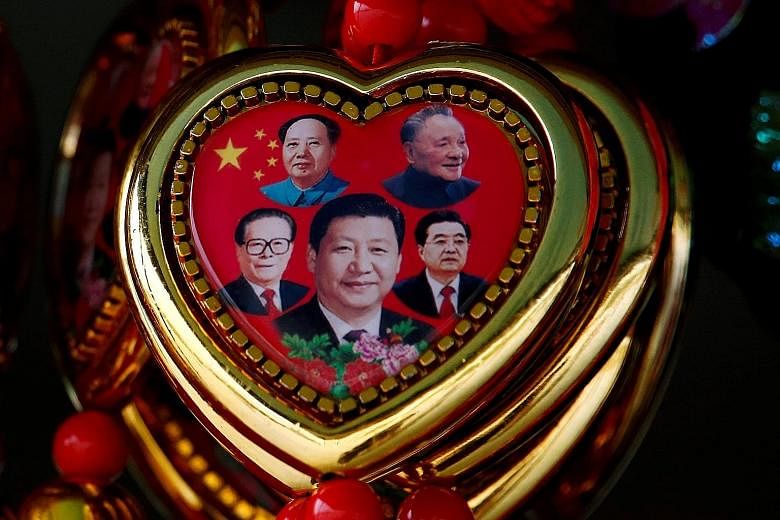 Left: A souvenir featuring portraits of (clockwise, from centre) Chinese President Xi Jinping and former leaders Jiang Zemin, Mao Zedong, Deng Xiaoping and Hu Jintao. China may face a closing "window of strategic opportunity" to secure greater influe