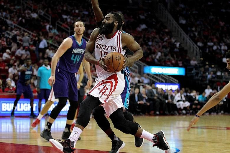 Rockets guard James Harden driving to the basket for a lay-up against the Hornets during the second quarter at Toyota Centre. His assist and two lay-ups right at the end were crucial after Charlotte had edged ahead.