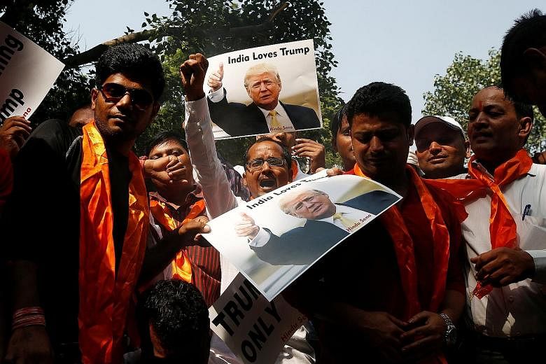 Members of a right-wing Hindu group at a pro-Trump demonstration in New Delhi last October. India should take advantage of Mr Trump's adversarial stance against China to develop equally good ties with China and the US, says the writer.
