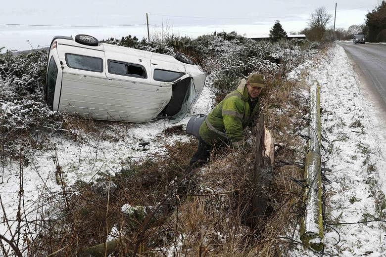 An accident caused by icy conditions near the town of Coalville in England. Since the end of last week, a winter cold snap across Europe has killed more than 60 people, with homeless people and migrants stranded in countries such as Greece and Serbia