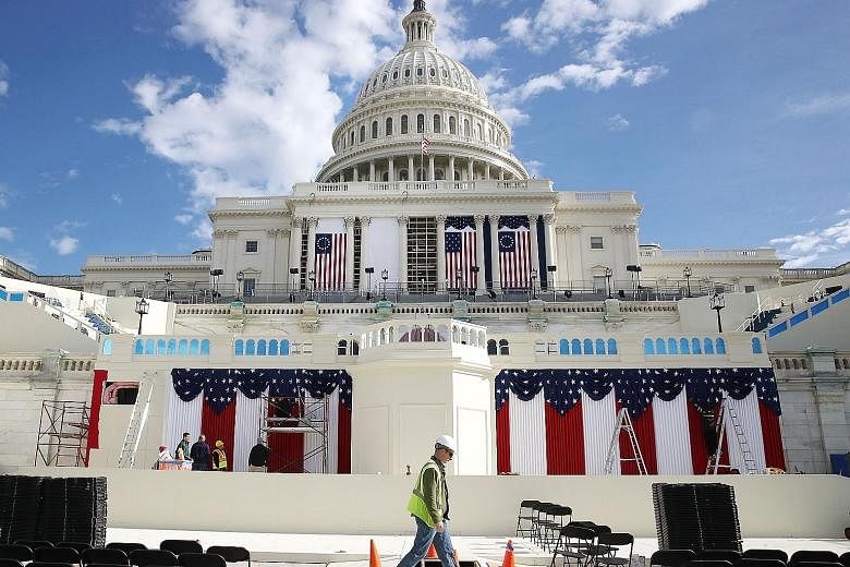 Work is ongoing at the stage ahead of Friday's inauguration at the US Capitol, where Mr Trump and Mr Pence will be sworn in.