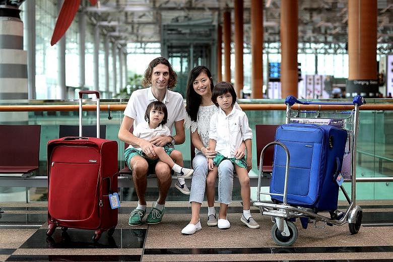 Get.com founders Pedro Pla and Grace Cheng with their children Ramses, four, and Ranefer, two. They set off today on a six-month trip using round-the-world business class tickets with SIA redeemed from 960,000 miles - all from the couple's credit car