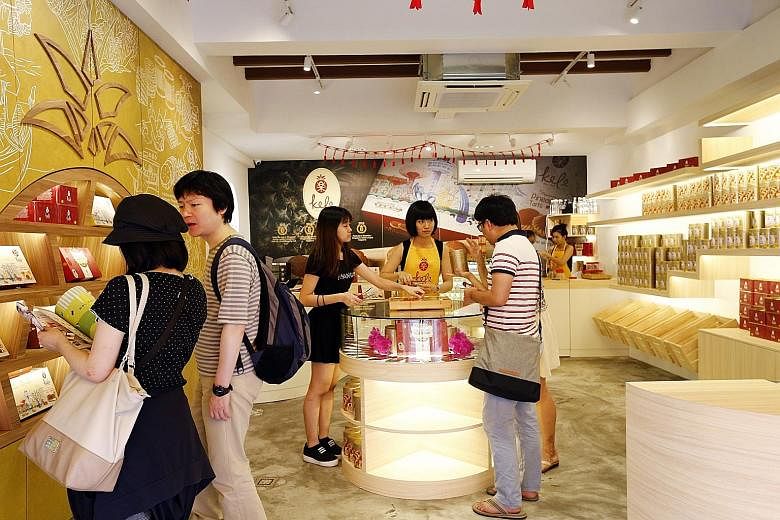 Prices of Chinese New Year goodies such as pineapple tarts, shrimp rolls and love letters are mostly the same as last year's.