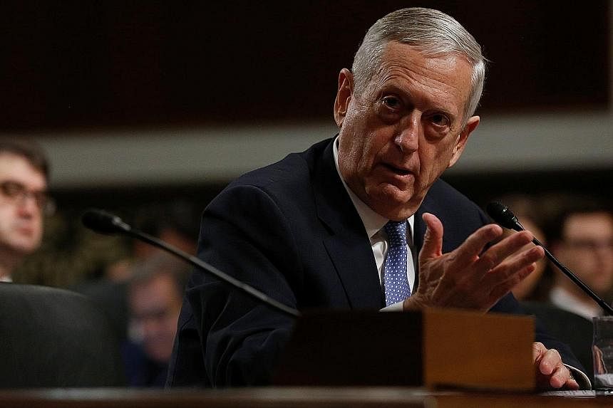 Secretary of state nominee Rex Tillerson (above) has called for Beijing to be denied access to its artificial islands in the South China Sea, but retired General James Mattis (below), nominee for defence secretary, did not endorse Mr Tillerson's mess