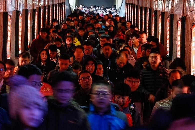 The Beijing Railway Station was packed with passengers last Friday.