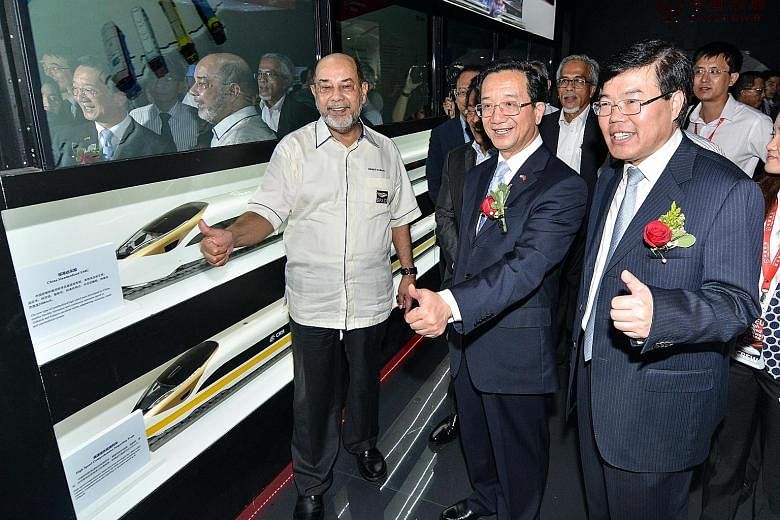 (From left) Malaysia's Land Public Transport Commission chairman Syed Hamid Albar, Chinese Ambassador to Malaysia Huang Huikang and China Railway International Group chairman Yang Zhongmin at the launch of the China High Speed Railway Experience Cube