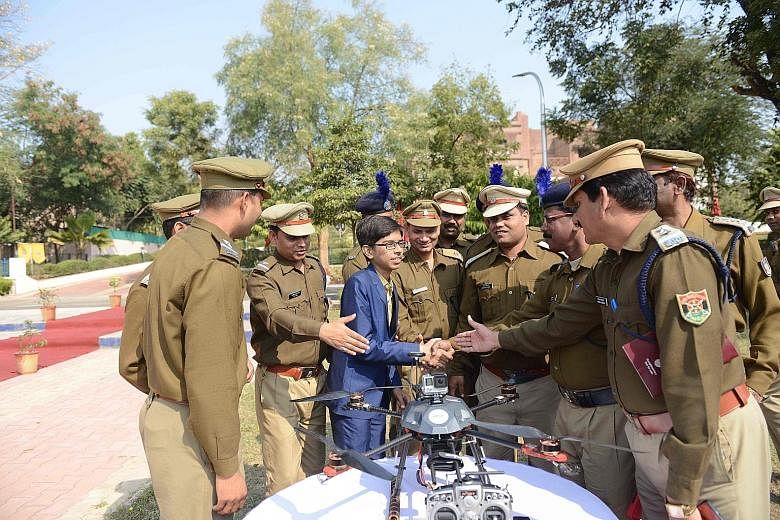 Indian student Harshwardhan Zala meeting Central Reserve Police Force officers to show them a drone he designed. The meeting took place at the Rapid Action Force Camp on the outskirts of Ahmedabad on Sunday. Zala began working on a prototype of the d