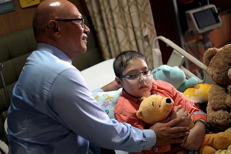 Shayan and Dr Goh at Mount Elizabeth Hospital yesterday. Since arriving deathly ill on Oct 13, the 10-year-old has made a miraculous recovery with the help of his doctor and crowdfunding efforts by a group of individuals here who found out about his 