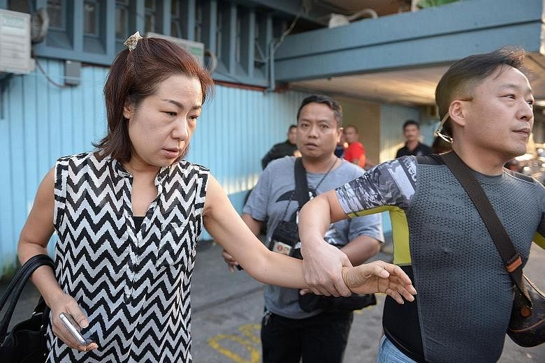 Mr Jee vanished from his home in the northern city of Angeles last October. Ms Choi, the wife of Mr Jee, being escorted by a friend at the National Bureau of Investigation headquarters in Manila yesterday. The authorities say Philippine police kidnap