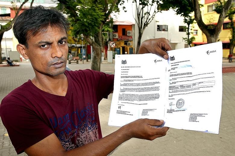 Mr Islam holding up the MOM letter directing him to the State Courts to recover the $7,363 his employer owed him after the boss missed the Labour Court's deadline. The legal action would cost him more than $1,000.