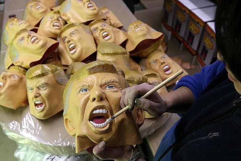 In Saitama, Japan, Ogawa Studio – the only manufacturer of rubber masks in the country – races to fulfil a flood of orders for Trump masks. Ogawa says most customers wear the masks at year-end parties and other social gatherings.