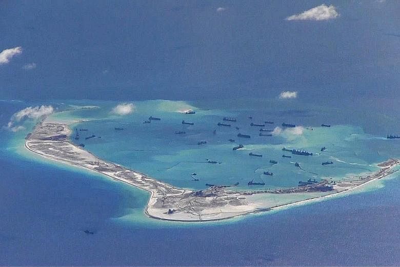 This US Navy surveillance image from 2015 purports to show Chinese dredging vessels in the waters around Mischief Reef, in the South China Sea's disputed Spratly Islands. If the new US administration weakens its engagement in the South China Sea, Bei