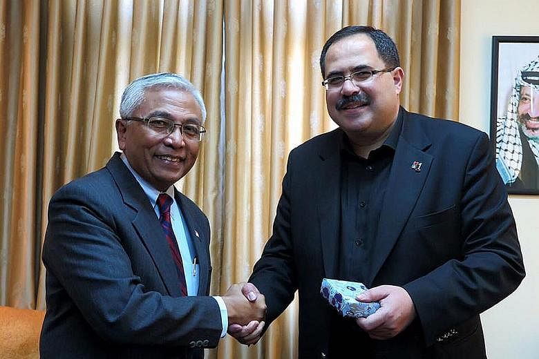 Mr Hawazi Daipi (far left) met Palestinian minister Sabri Saidam, on his first visit to the Palestinian Territories since being appointed Singapore's representative last year.