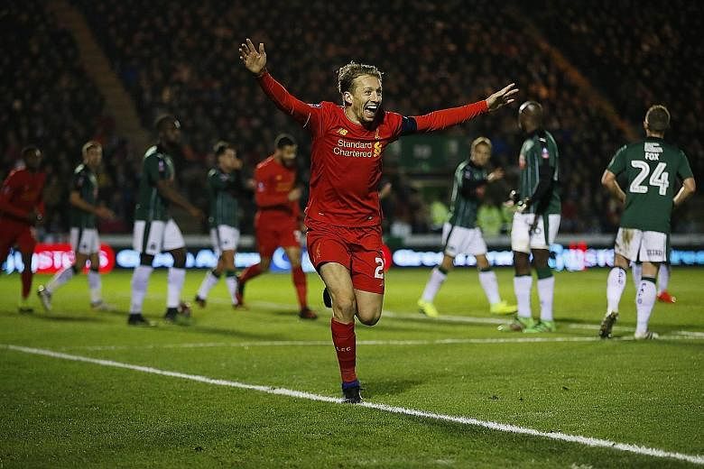 Liverpool's Lucas Leiva celebrating his drought-breaking goal against Plymouth in their FA Cup encounter on Wednesday. The Brazilian headed home from Philippe Coutinho's corner for his first goal in seven years, even as the tug-of-war over his future