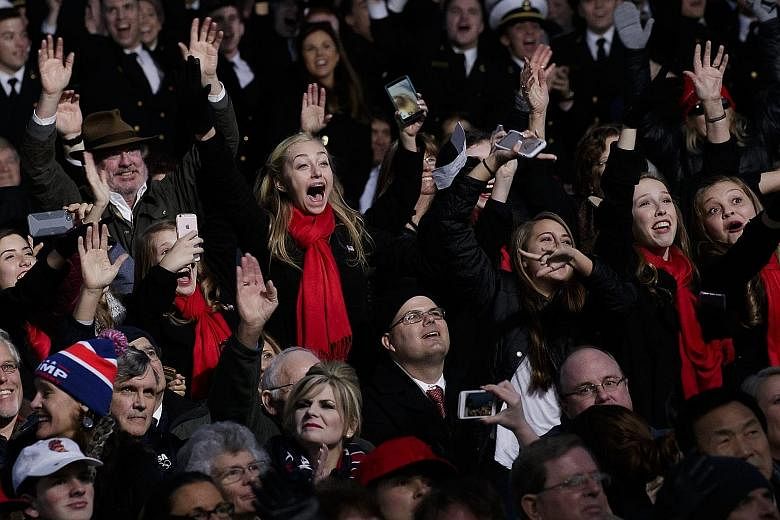 The audience cheering during the Make America Great Again! Welcome Celebration for Mr Trump at the Lincoln Memorial on Thursday that was anchored by country music veterans.