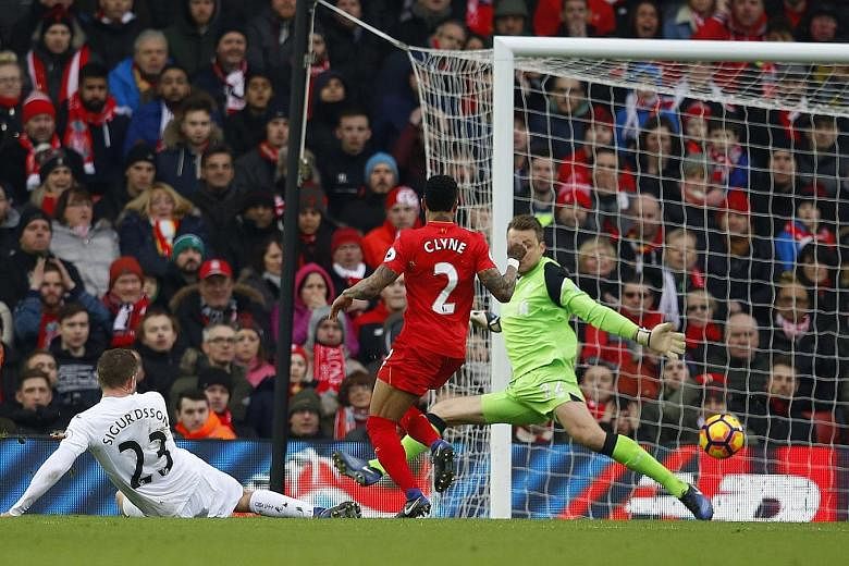 Swansea's Gylfi Sigurdsson finishing past Liverpool's Simon Mignolet to hand his side a first win at Anfield and a much-needed three points to haul them off the foot of the table.