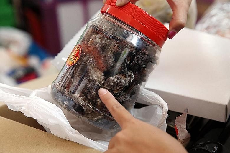 This container of mouldy dates was found in a box of donations at The Food Bank Singapore. The charity discards about 10 to 20 per cent of the 240 tonnes of food that it receives each year.