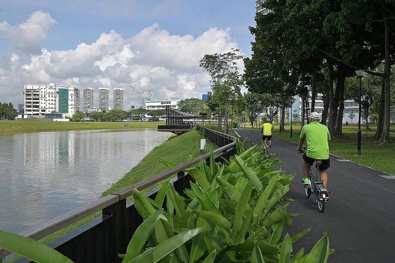 Cyclists enjoy the scenery along a 320m stretch of the Kallang River that has been revitalised with rain gardens and viewing decks, in the latest ABC Waters project.