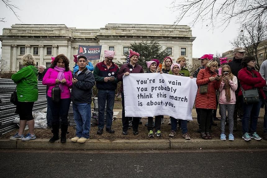 Women's March participants took to the streets in cities around the world last Saturday, including Berlin (right) and Washington (above), where the turnout was at least double that at last Friday's presidential inauguration. Speakers and marchers cam