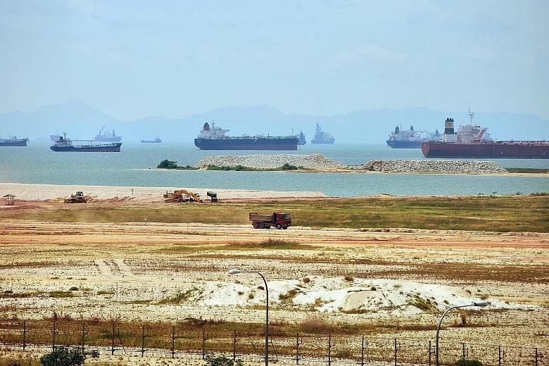 Singapore depends on sand for both reclamation (left) and construction activities.