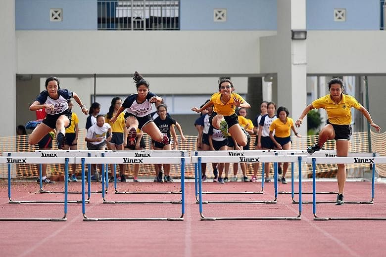 Cedar Girls' Secondary School students at the 1998 National Inter-School Track and Field Championships at the National Stadium. Above: Athletes from Cedar Girls' Secondary at a recent training session. In the almost 50 years since 1968, the school ha