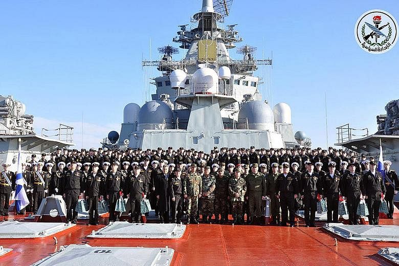 The Chief of General Staff of the Syrian Army and Armed Forces, General Ali Abdullah Ayoub (centre), with the crew of Russian aircraft carrier Admiral Kuznetsov at Tartus earlier this month. The new Russian agreement with Syria provides for an expans
