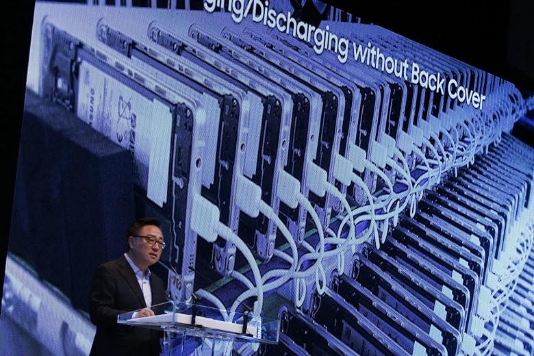 Mr Koh, head of Samsung's mobile business, at the press conference yesterday. Analysts say the company is looking to move on through the announcement, which did not implicate other devices.