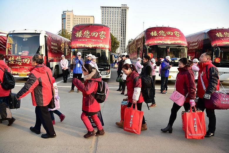 Fuyang city in China's Anhui province providing free transport at Fuyang Railway Station Square last Saturday to take returning migrant workers home for Chinese New Year.